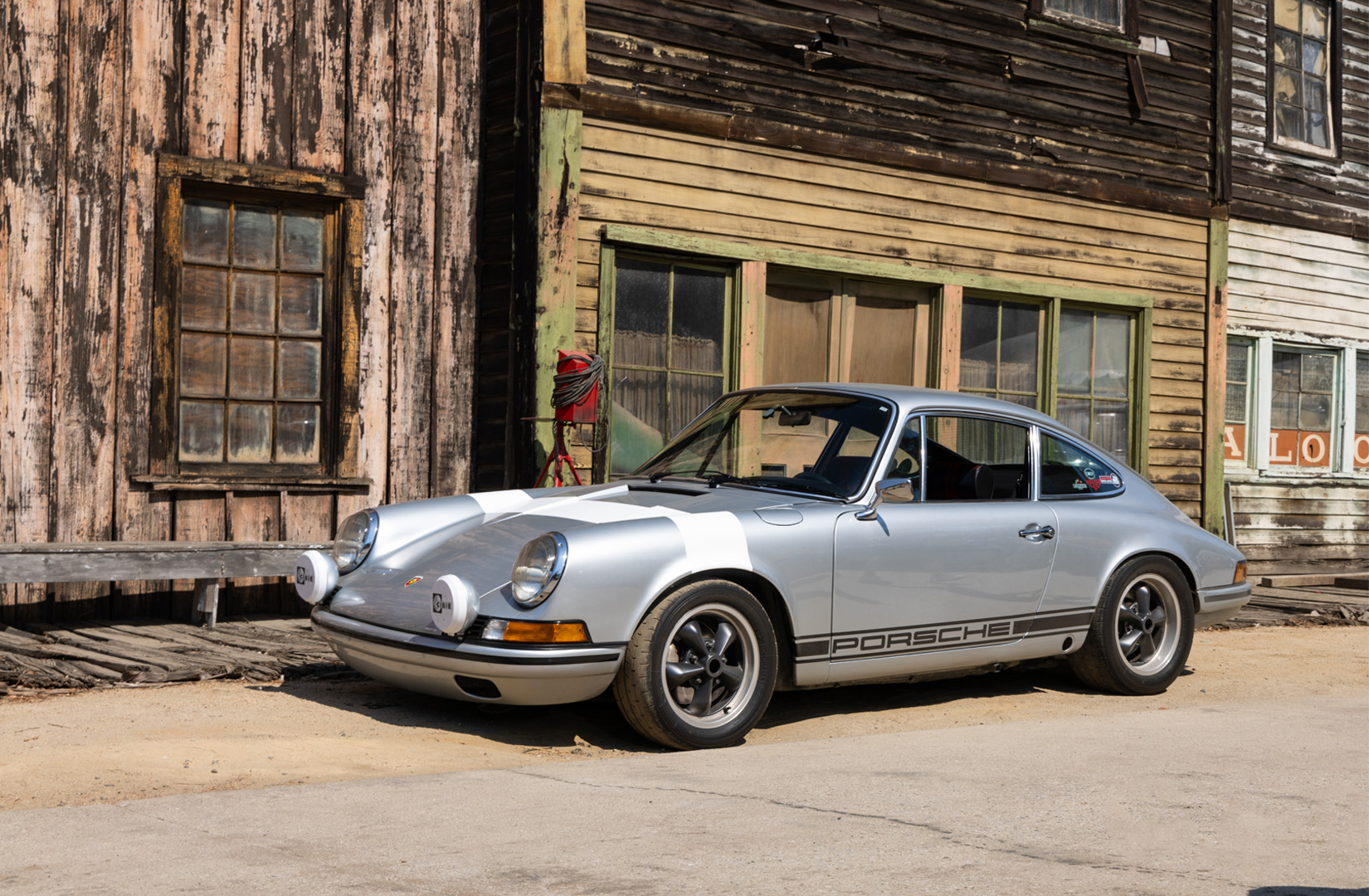 silver Porsche parked on movie lot for event