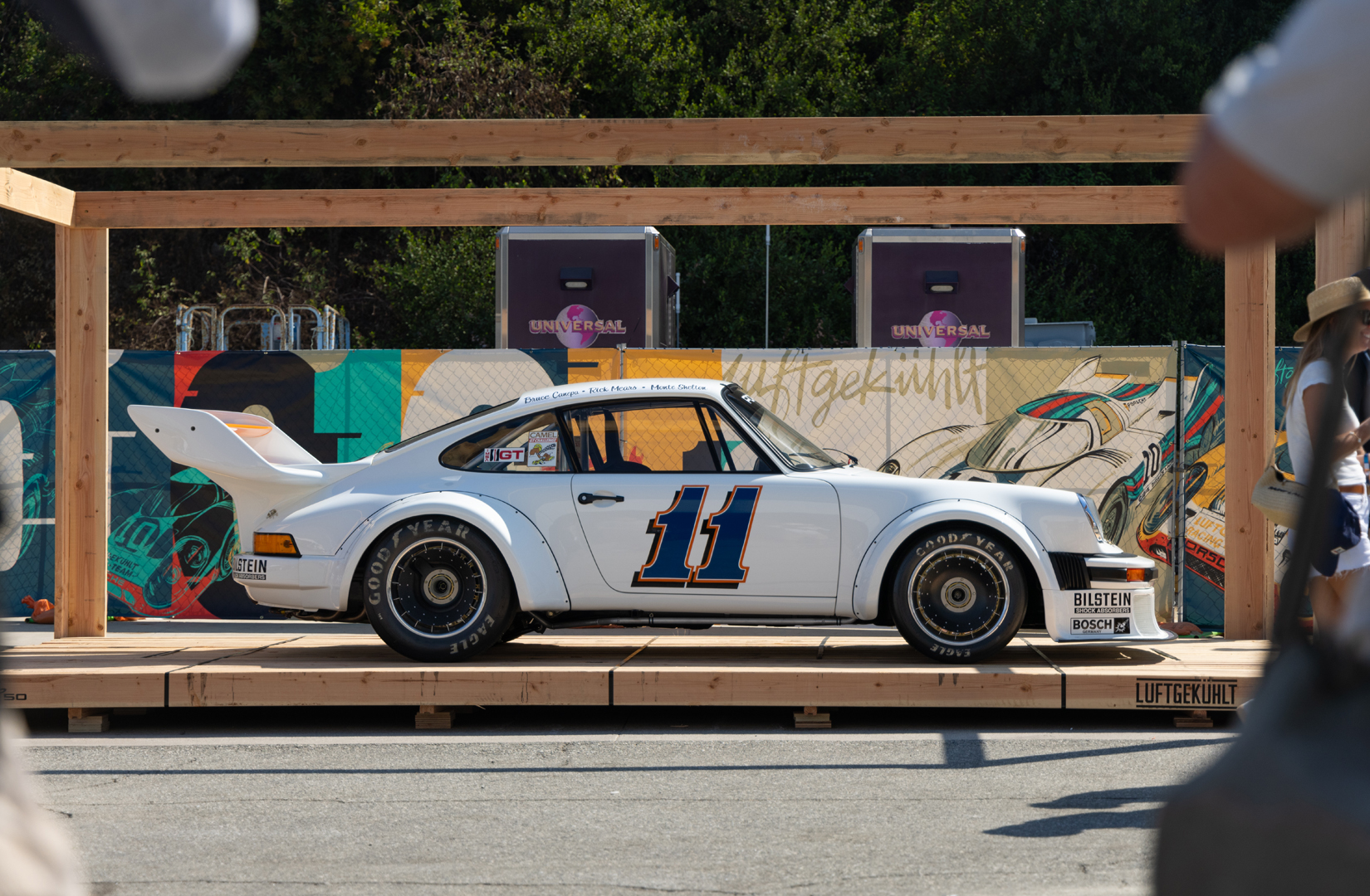 Classic Porsche race car sitting on shipping pallet displayed