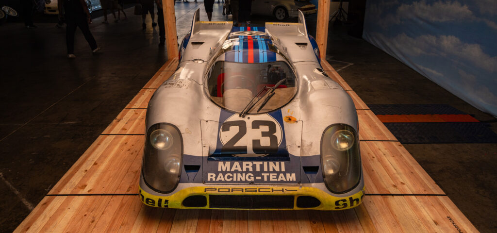 Vintage Porsche race car sitting on wood pallet