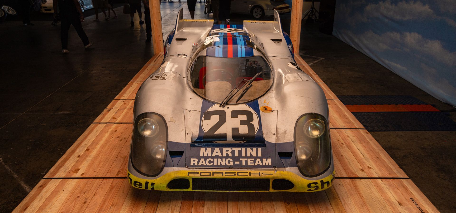 Vintage Porsche race car sitting on wood pallet